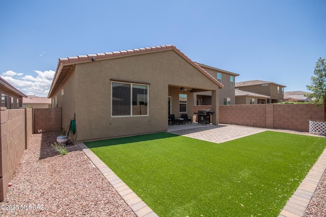 7688 S Via Perfecta, Tucson, AZ 85756 - rear view of property featuring stucco siding, ceiling fan, and a patio area
