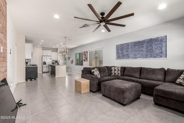 7688 S Via Perfecta, Tucson, AZ 85756 - living area with ceiling fan, recessed lighting, a chandelier, and light tile patterned floors