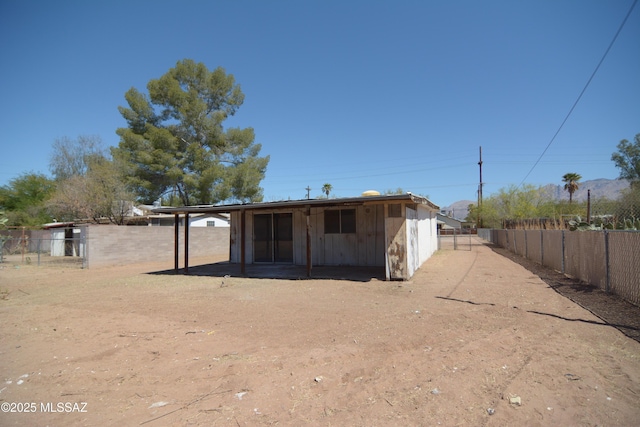 view of outbuilding with fence