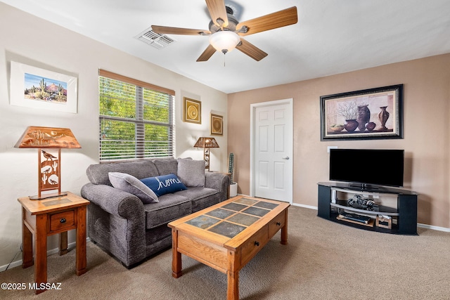 living room with baseboards, ceiling fan, carpet, and visible vents
