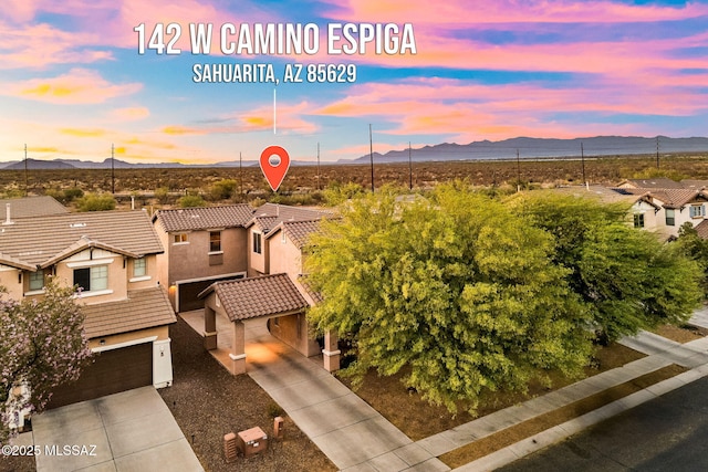 drone / aerial view with a mountain view and a residential view