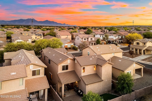 drone / aerial view with a residential view and a mountain view