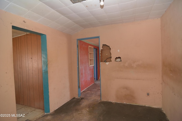 corridor featuring lofted ceiling