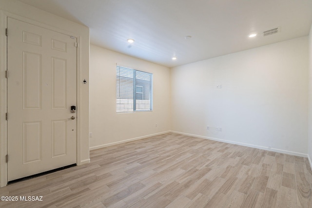kitchen featuring white cabinets, appliances with stainless steel finishes, visible vents, and light wood-style floors