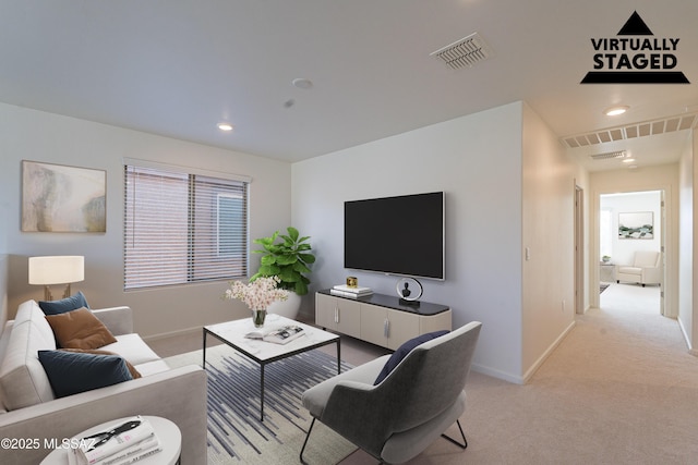 spare room featuring visible vents, baseboards, and light carpet