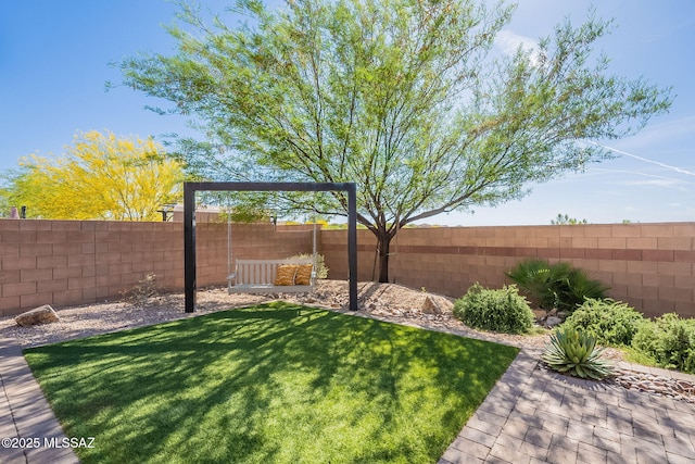 view of yard with a fenced backyard