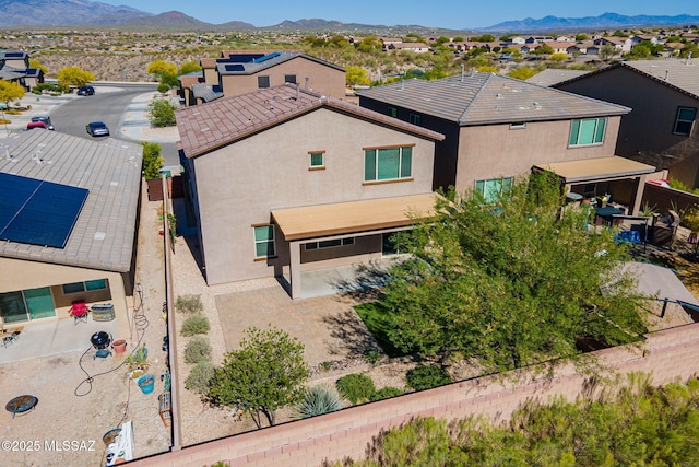 birds eye view of property with a mountain view and a residential view