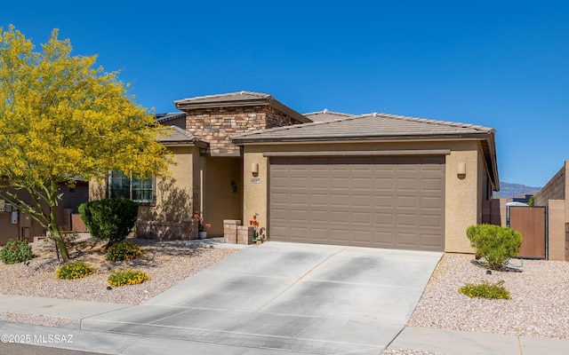 10199 S Pantano Knolls Dr, Vail, AZ 85641 - prairie-style home with an attached garage, a tile roof, stucco siding, a gate, and driveway