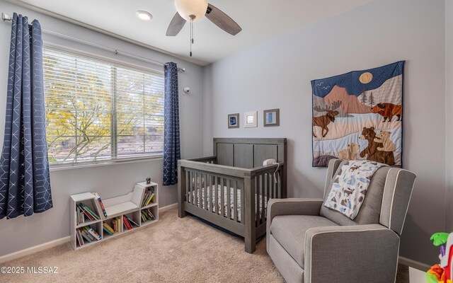10199 S Pantano Knolls Dr, Vail, AZ 85641 - bedroom with carpet floors, baseboards, ceiling fan, and a crib