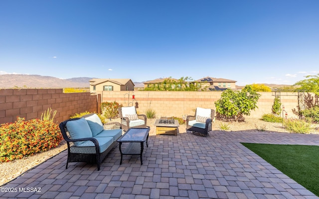 10199 S Pantano Knolls Dr, Vail, AZ 85641 - view of patio featuring a fenced backyard, a fire pit, and a mountain view