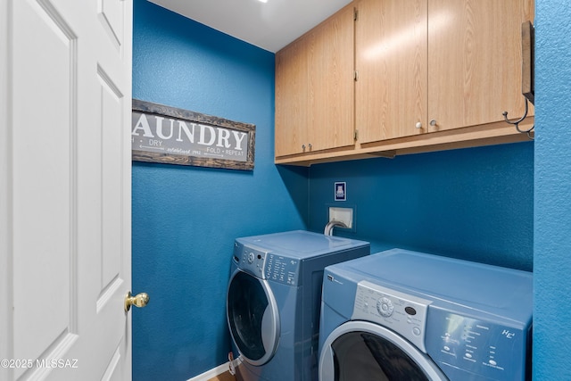 9949 N Blue Crossing Way, Tucson, AZ 85743 - laundry room featuring cabinet space, washer and clothes dryer, a textured wall, and baseboards
