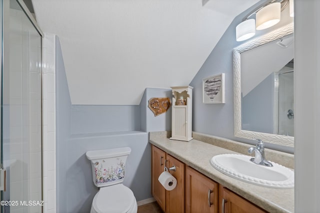 9949 N Blue Crossing Way, Tucson, AZ 85743 - bathroom featuring lofted ceiling, a tile shower, vanity, and toilet