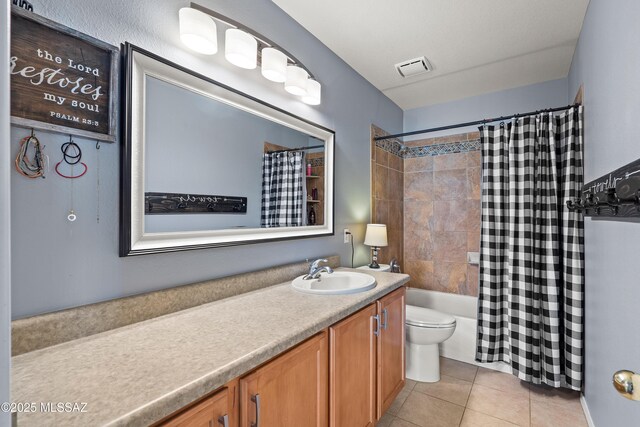 9949 N Blue Crossing Way, Tucson, AZ 85743 - bathroom featuring vanity, toilet, tile patterned floors, and shower / bath combo with shower curtain