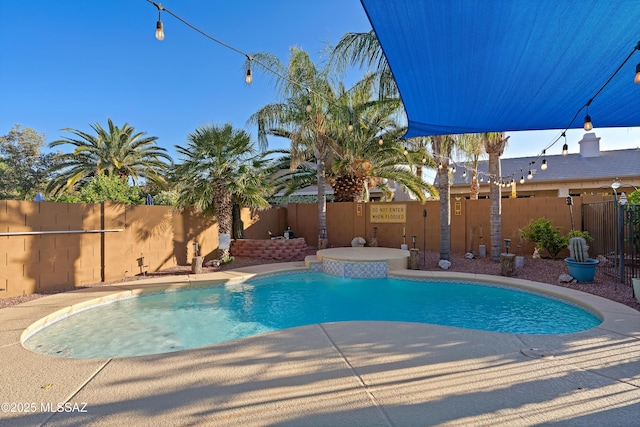 9949 N Blue Crossing Way, Tucson, AZ 85743 - view of swimming pool featuring a fenced backyard and a patio