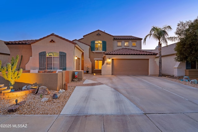 9949 N Blue Crossing Way, Tucson, AZ 85743 - mediterranean / spanish home with stucco siding, a tile roof, driveway, and a garage