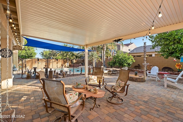 9949 N Blue Crossing Way, Tucson, AZ 85743 - view of patio with a fire pit and a fenced backyard