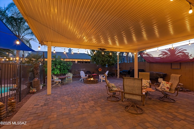 9949 N Blue Crossing Way, Tucson, AZ 85743 - view of patio / terrace with a fire pit and a fenced backyard