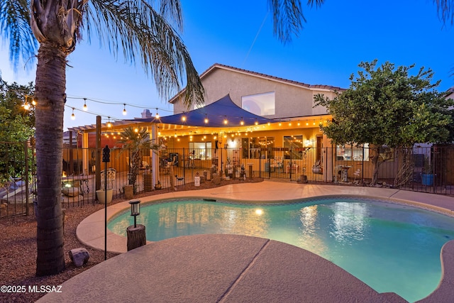 9949 N Blue Crossing Way, Tucson, AZ 85743 - view of swimming pool featuring fence and a patio