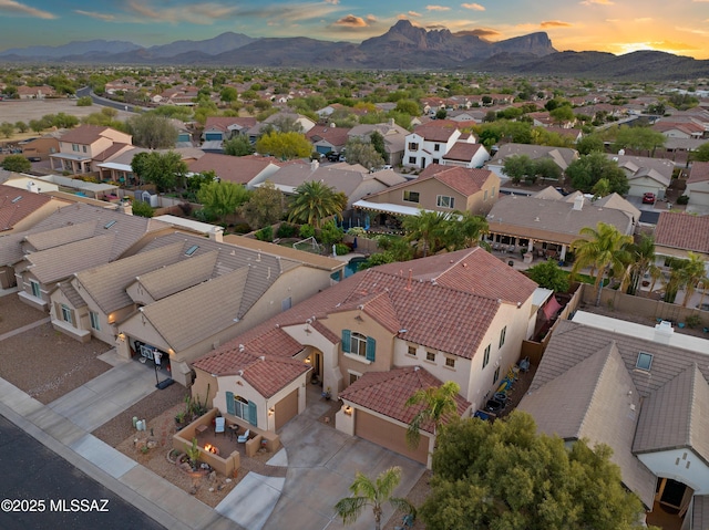 9949 N Blue Crossing Way, Tucson, AZ 85743 - aerial view at dusk of a residential view and a mountain view
