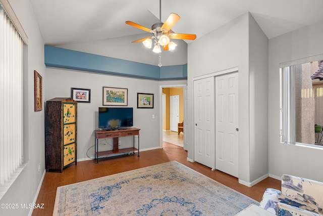9949 N Blue Crossing Way, Tucson, AZ 85743 - bedroom with a closet, wood finished floors, baseboards, a ceiling fan, and high vaulted ceiling