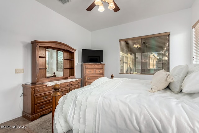 5884 S Azure Vista Way, Green Valley, AZ 85622 - bedroom featuring light tile patterned floors, a ceiling fan, and lofted ceiling