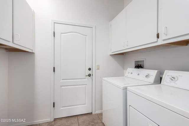 5884 S Azure Vista Way, Green Valley, AZ 85622 - laundry area featuring cabinet space, washer and clothes dryer, light tile patterned floors, and baseboards