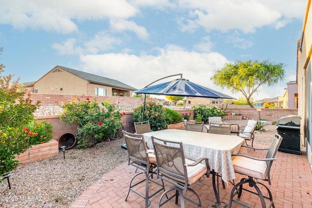 5884 S Azure Vista Way, Green Valley, AZ 85622 - view of patio with a fenced backyard, outdoor dining space, and area for grilling