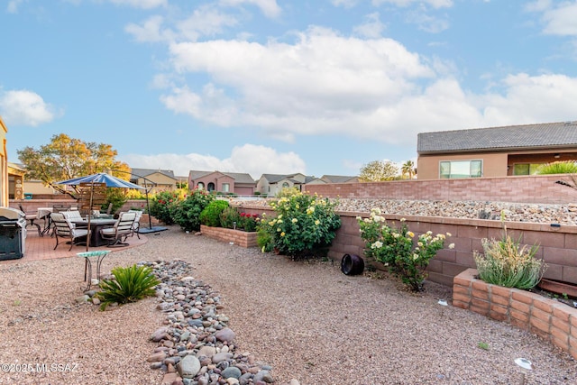 5884 S Azure Vista Way, Green Valley, AZ 85622 - fenced backyard featuring a patio area and a residential view