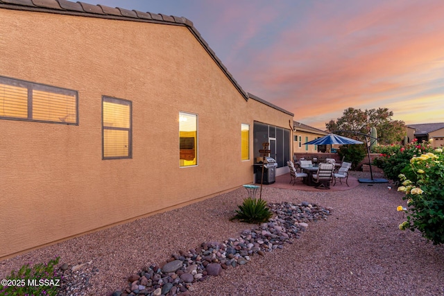 5884 S Azure Vista Way, Green Valley, AZ 85622 - view of property exterior featuring a patio and stucco siding