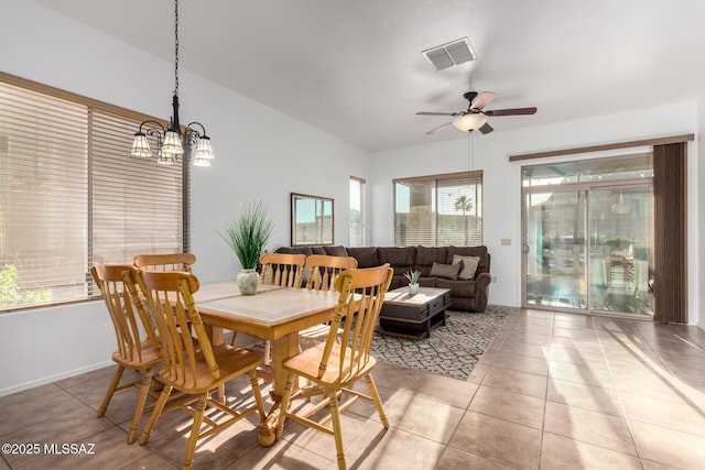 5884 S Azure Vista Way, Green Valley, AZ 85622 - dining area with light tile patterned flooring, ceiling fan, a chandelier, and baseboards