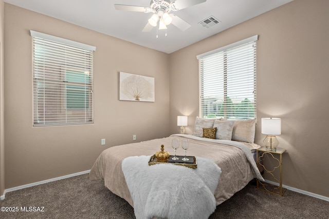 bedroom with baseboards, ceiling fan, carpet, and visible vents