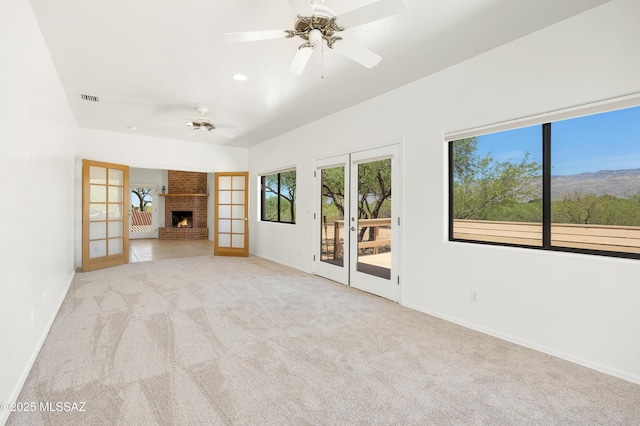 12471 E Speedway Blvd, Tucson, AZ 85748 - unfurnished living room with carpet floors, ceiling fan, recessed lighting, and a brick fireplace