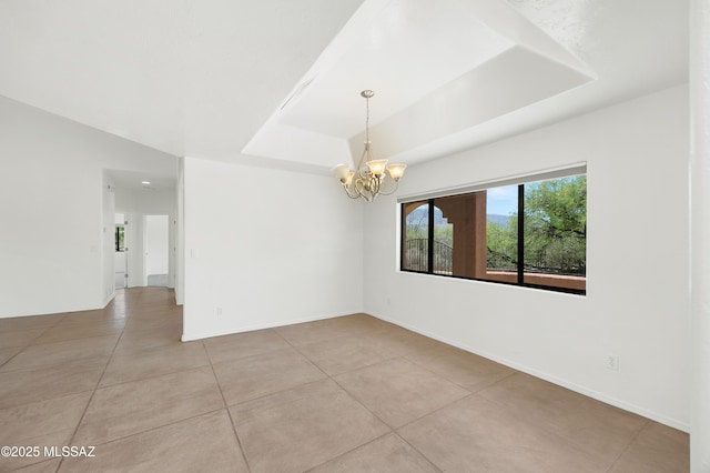 12471 E Speedway Blvd, Tucson, AZ 85748 - unfurnished room featuring a raised ceiling, a chandelier, and light tile patterned flooring