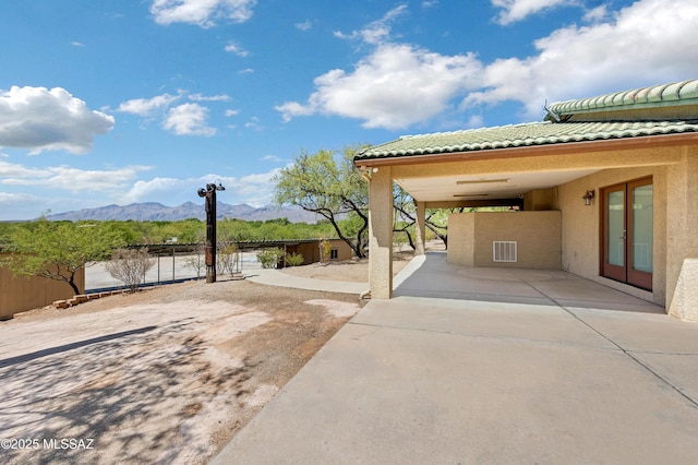 12471 E Speedway Blvd, Tucson, AZ 85748 - view of patio with a mountain view, french doors, driveway, and a carport