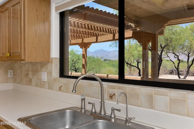 12471 E Speedway Blvd, Tucson, AZ 85748 - kitchen view of light countertops and tasteful backsplash