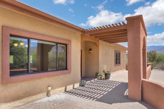 view of patio / terrace featuring a mountain view