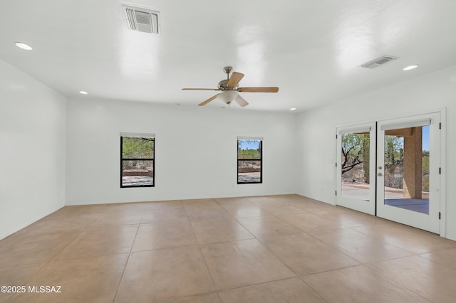 12471 E Speedway Blvd, Tucson, AZ 85748 - spare room featuring light tile patterned floors, recessed lighting, french doors, and ceiling fan