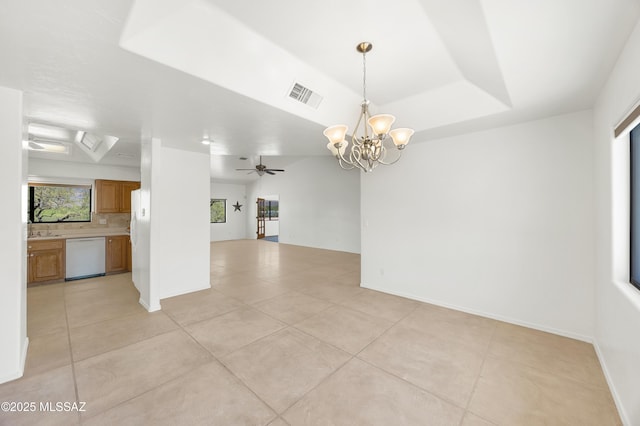 12471 E Speedway Blvd, Tucson, AZ 85748 - empty room with light tile patterned floors, a chandelier, a ceiling fan, and a tray ceiling