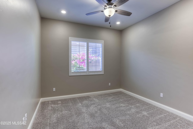 carpeted spare room featuring ceiling fan, baseboards, and recessed lighting