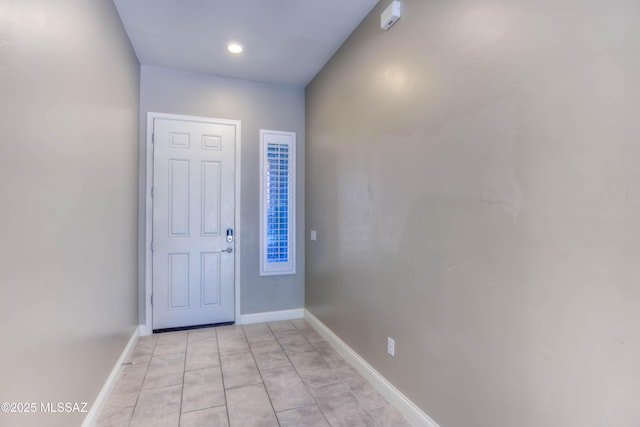 entrance foyer with light tile patterned floors, baseboards, and recessed lighting