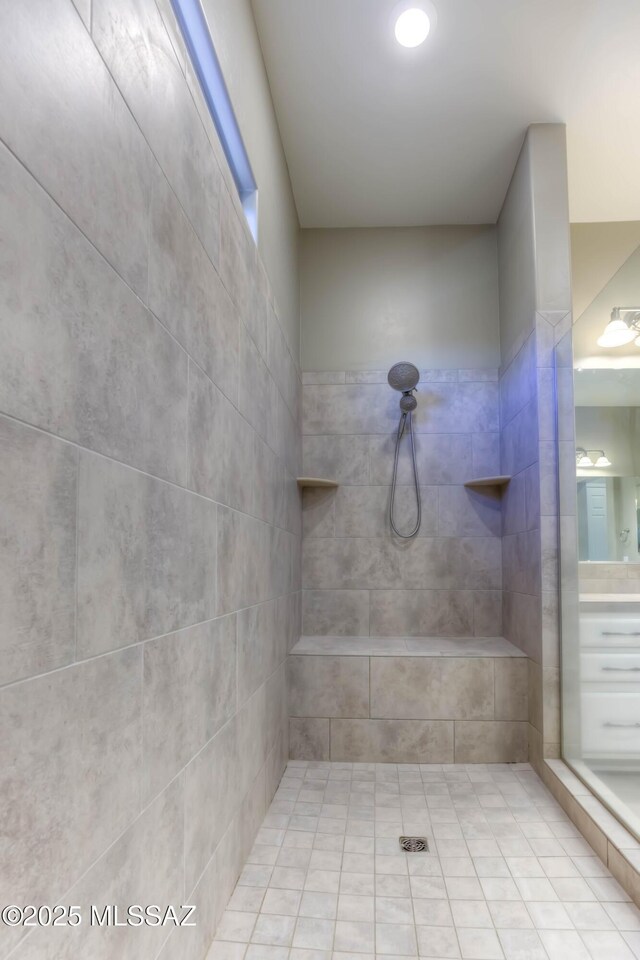 full bath featuring a tile shower