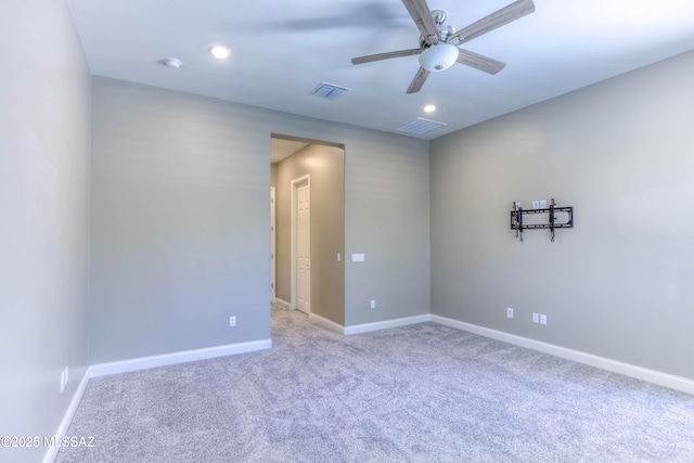 carpeted spare room with baseboards, a ceiling fan, visible vents, and recessed lighting