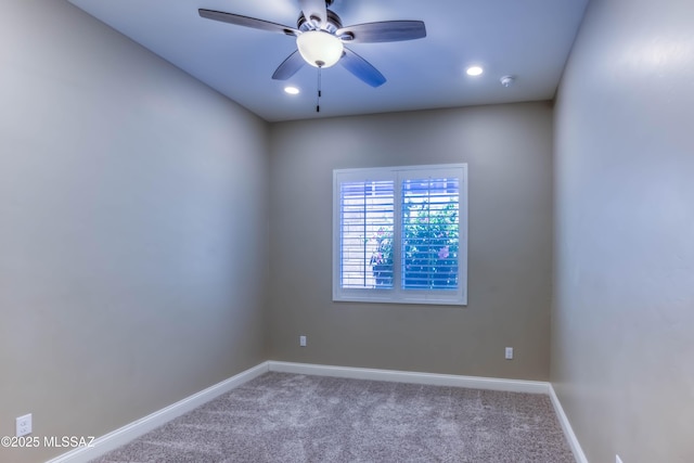 unfurnished room with carpet flooring, baseboards, and a ceiling fan