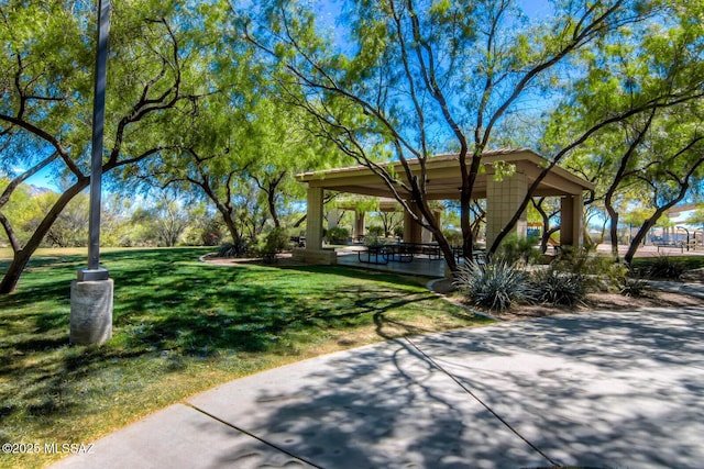 surrounding community featuring a gazebo and a lawn