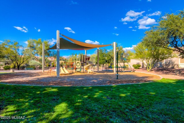 community jungle gym featuring a yard