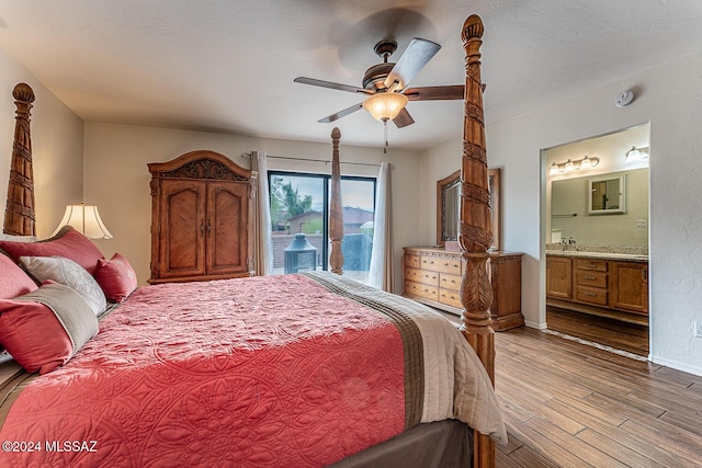 bedroom featuring ceiling fan, access to exterior, baseboards, ensuite bathroom, and light wood-type flooring
