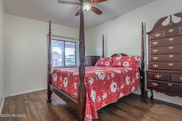 bedroom with a ceiling fan, baseboards, and wood finished floors