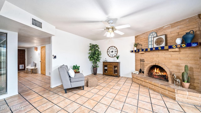 900 N Camino Del Codorniz, Tucson, AZ 85749 - living room featuring light tile patterned floors, a ceiling fan, and a brick fireplace