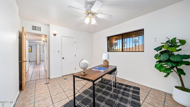 900 N Camino Del Codorniz, Tucson, AZ 85749 - home office featuring light tile patterned floors, a ceiling fan, and baseboards