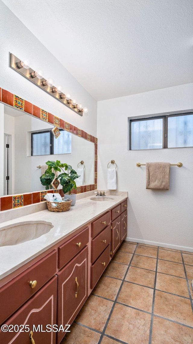 900 N Camino Del Codorniz, Tucson, AZ 85749 - full bathroom with double vanity, tile patterned floors, and a textured ceiling
